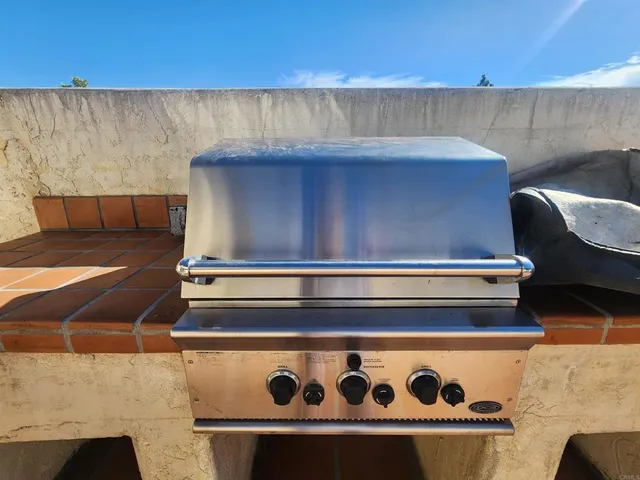 a stove top oven sitting inside of a kitchen