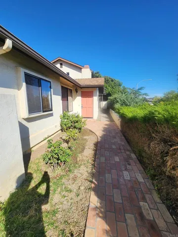 a house with trees in the background