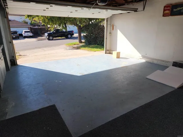 a view of living room with furniture and cars