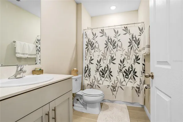 a bathroom with a toilet and a sink