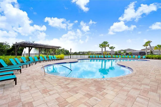 a utility room with a cabinet and mirror