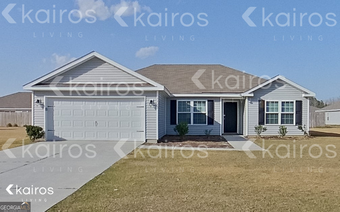 228 Western Red Cedar Drive Springfield, GA 31329 - Photo 1 of 27 a front view of a house with a yard