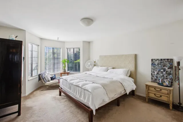 a bedroom with a bed and a television