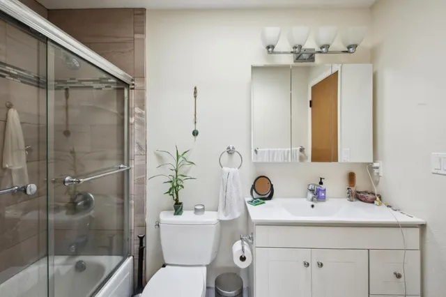 a bedroom with a bed and cabinets