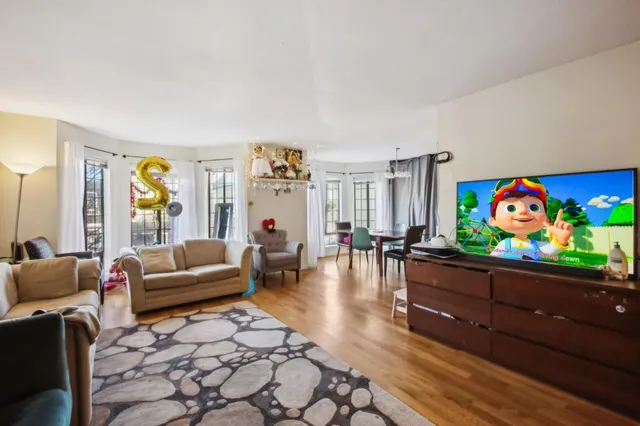 a view of a dining room with furniture and window