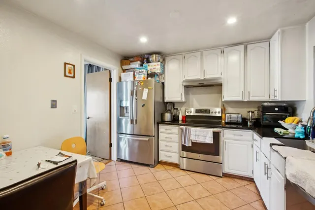 a bathroom with a sink and mirror with toilet