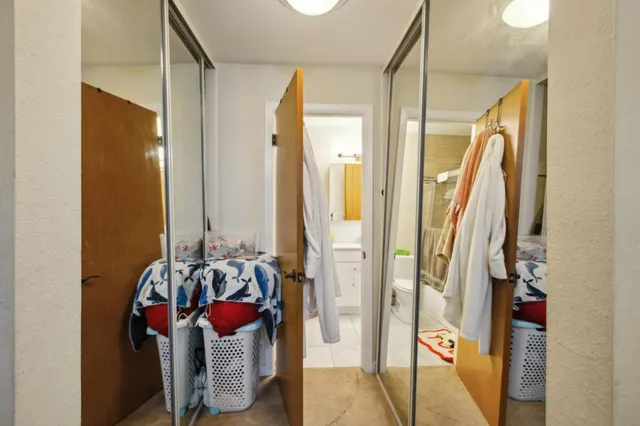 a bedroom with furniture and wooden floor