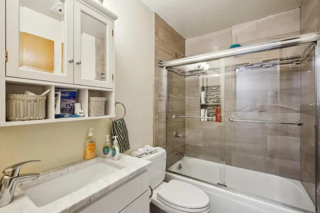 a utility room with dryer washer and closet