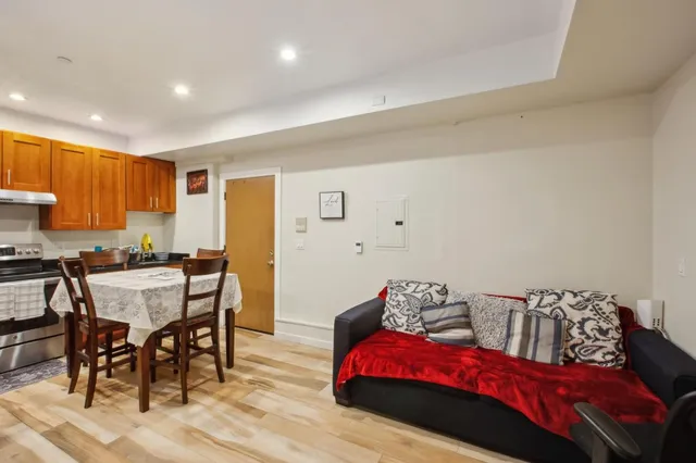 a view of a patio with table and chairs and wooden floor