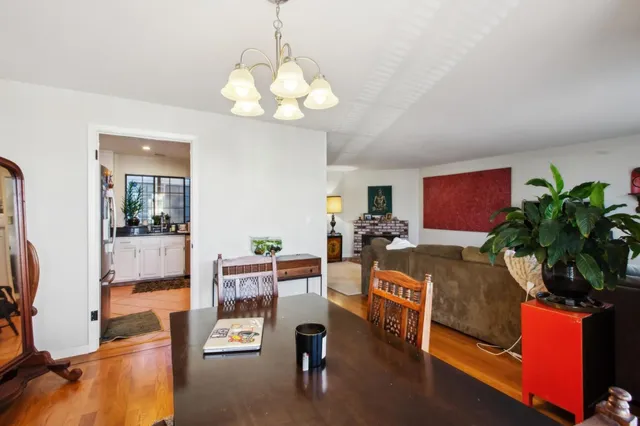 a kitchen with a sink a refrigerator and cabinets