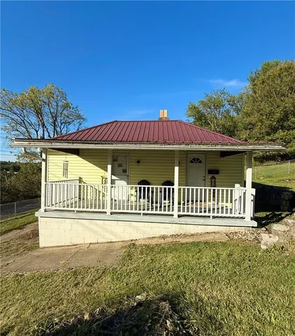 a view of a house with a yard balcony