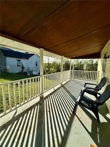 a kitchen with granite countertop a stove a sink and a refrigerator