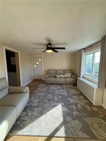 a bed sitting in a room next to a window