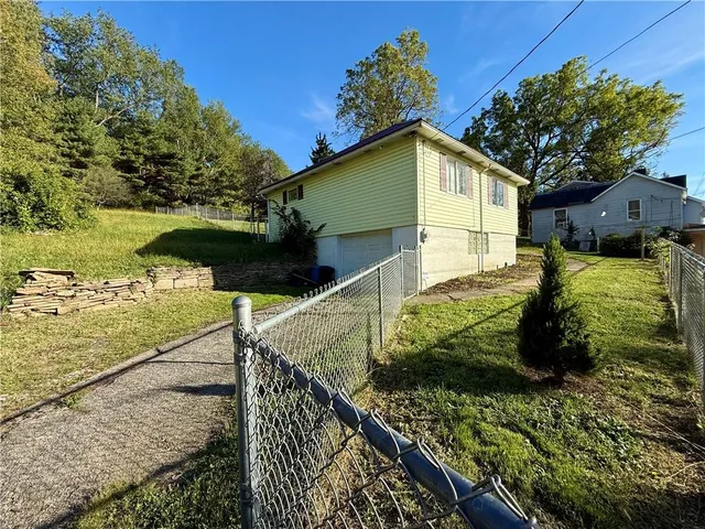 a view of a backyard with plants
