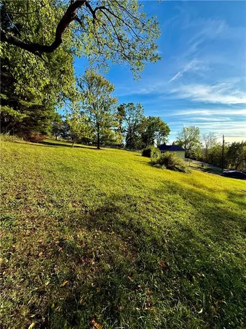 a view of an ocean and a yard