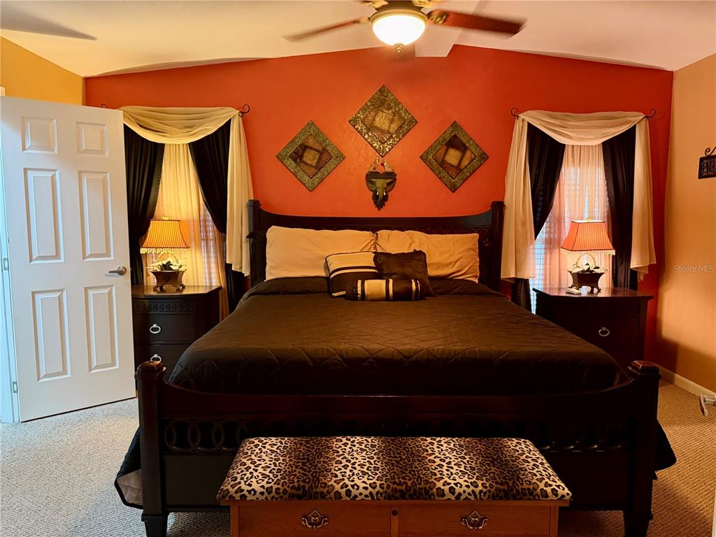 1329 Southwest 44th Boulevard Okeechobee, FL 34974 - Photo 16 of 39 a bedroom with a bed and window