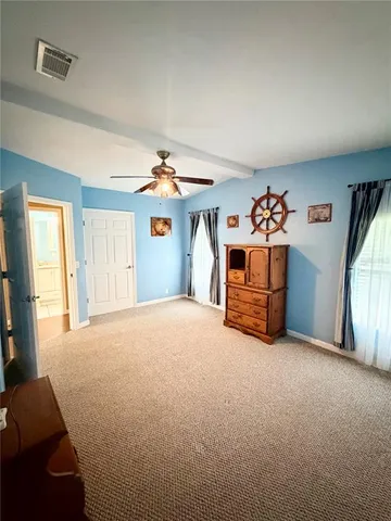 a bathroom with a sink a toilet and a shower