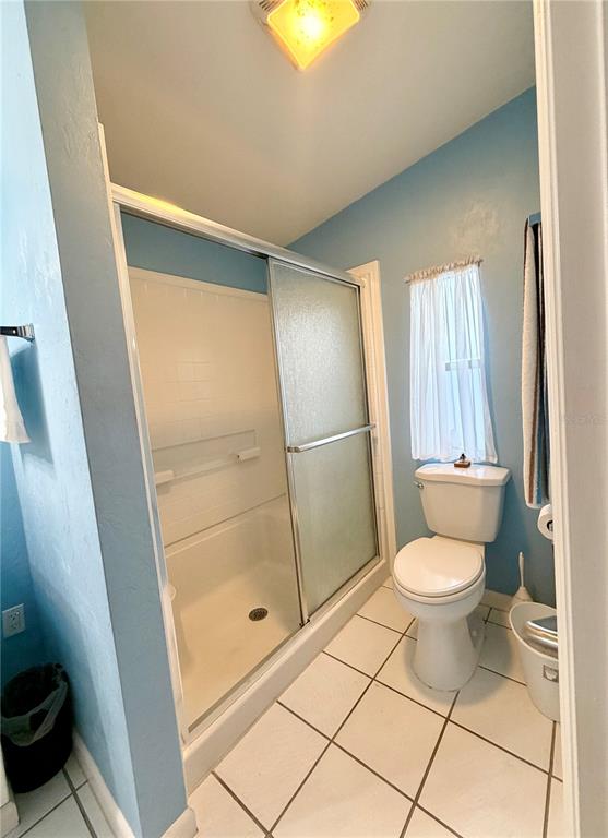 1329 Southwest 44th Boulevard Okeechobee, FL 34974 - Photo 28 of 39 a bathroom with a toilet and a shower