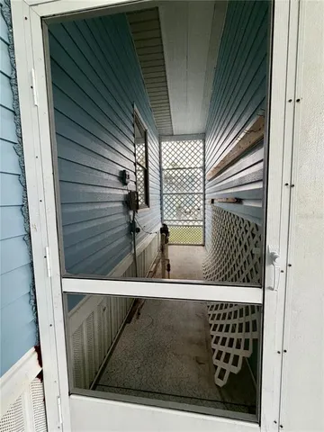 a view of a garden with wooden fence