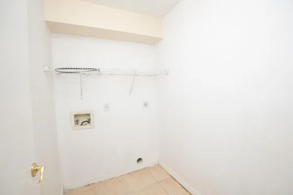 a bathroom with a window and a white door