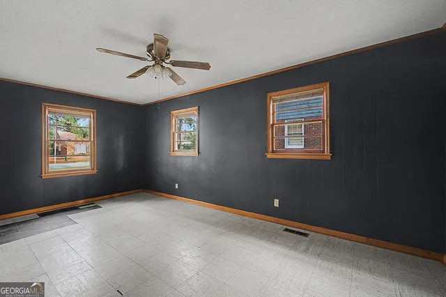 a view of an empty room with a window