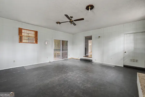a view of an empty room with a window