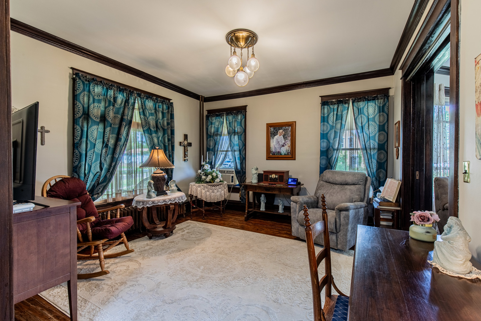 304 Locust Street Mineral, IL 61344 - Photo 12 of 38 a living room with furniture and a flat screen tv