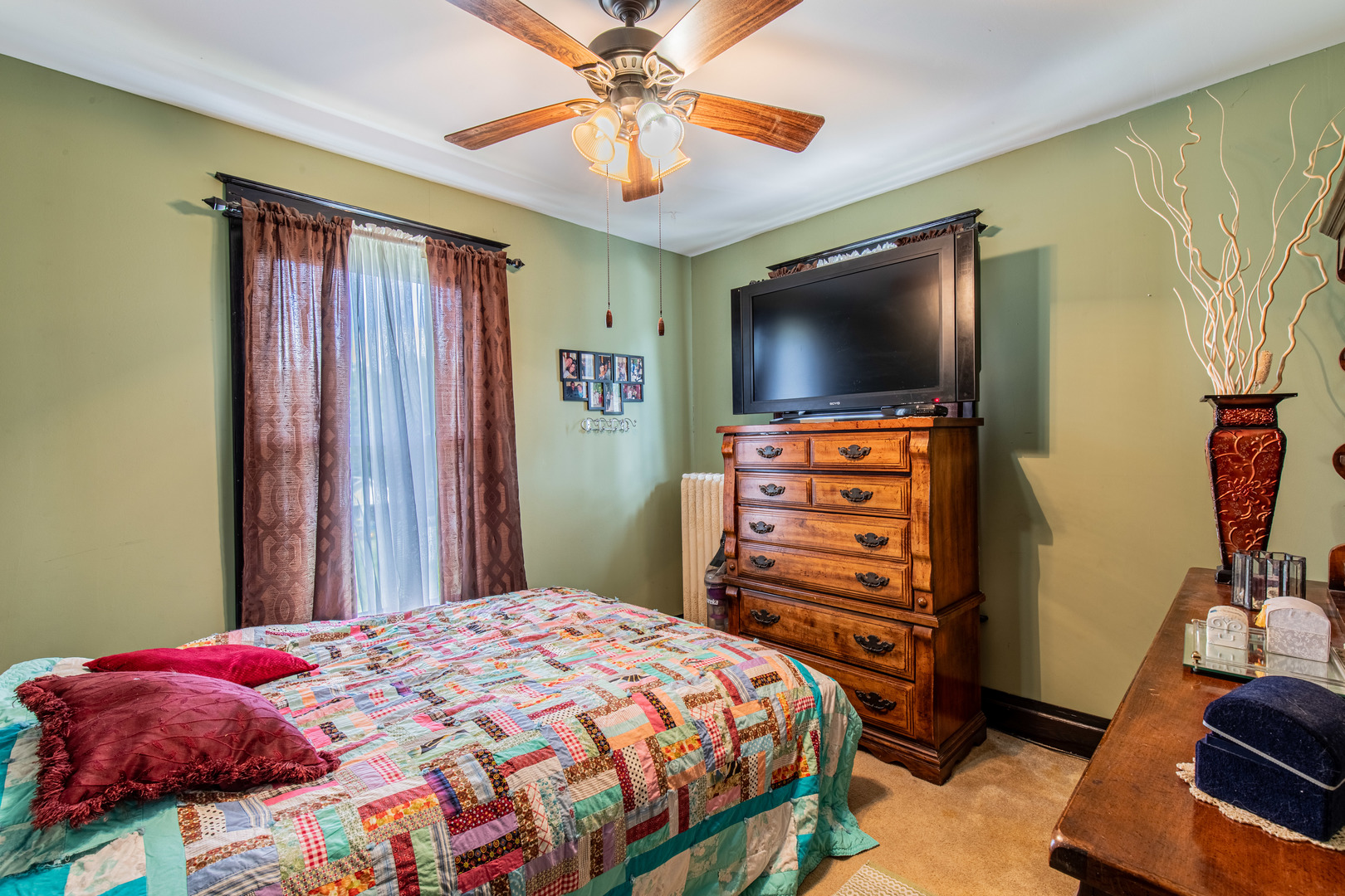 304 Locust Street Mineral, IL 61344 - Photo 27 of 38 a bedroom with a bed and a flat screen tv