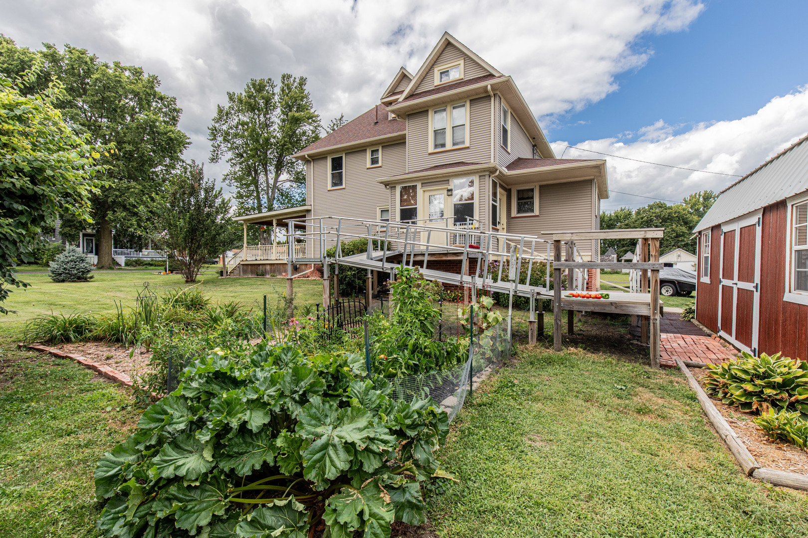 304 Locust Street Mineral, IL 61344 - Photo 34 of 38 a view of a house with a yard