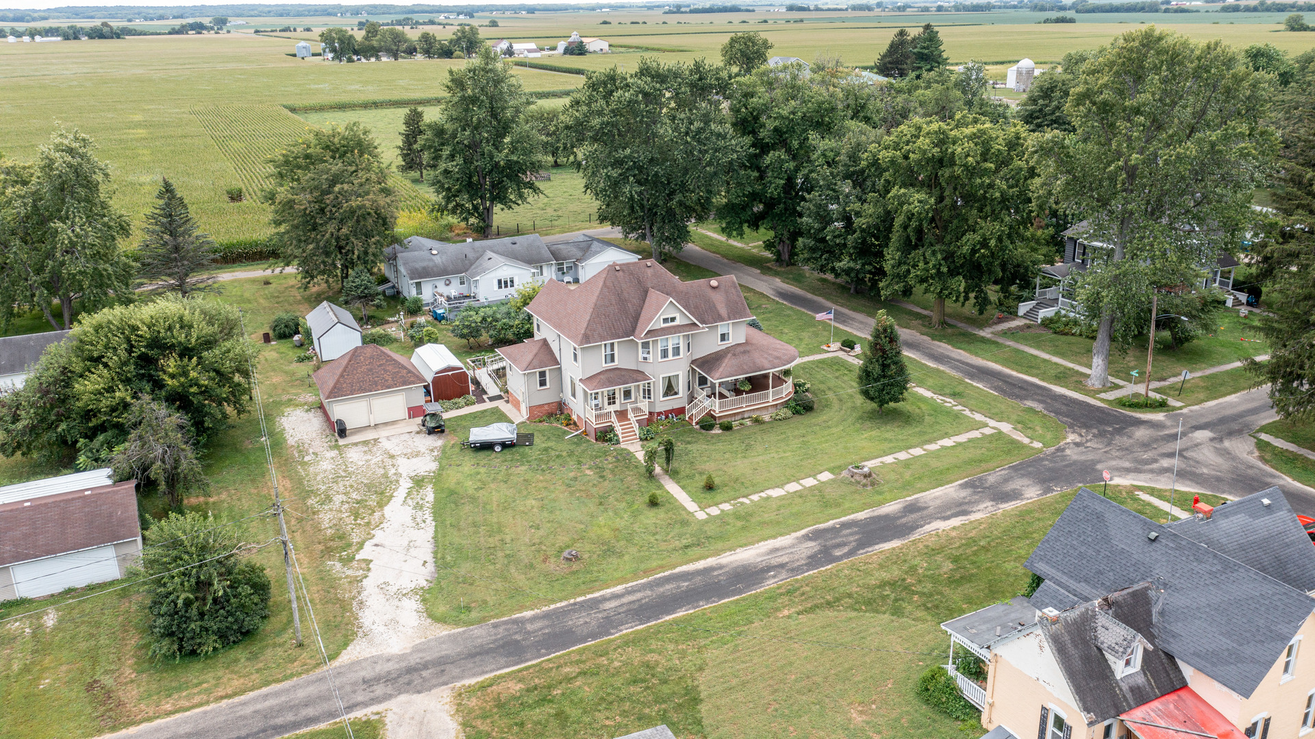 304 Locust Street Mineral, IL 61344 - Photo 35 of 38 an aerial view of a house with a garden and lake view