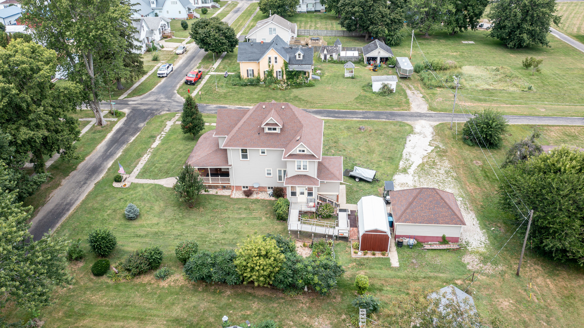 304 Locust Street Mineral, IL 61344 - Photo 37 of 38 an aerial view of a house with a garden and swimming pool