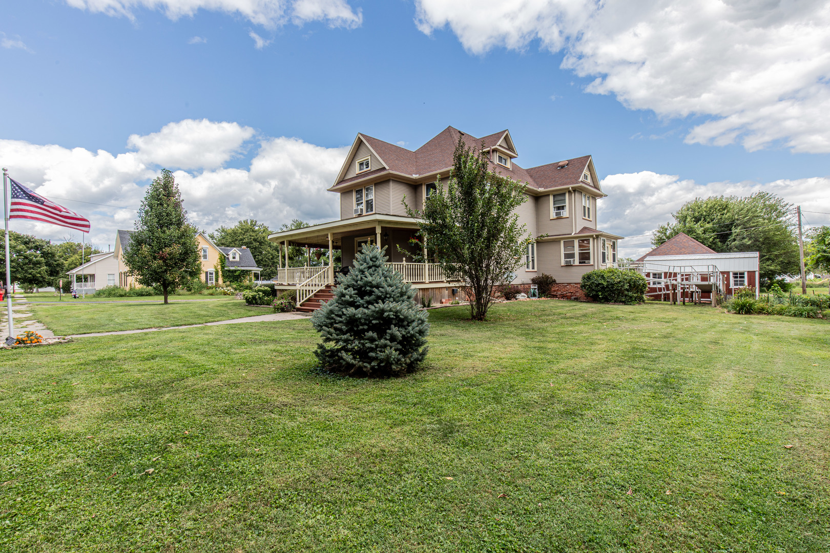 304 Locust Street Mineral, IL 61344 - Photo 5 of 38 a front view of a house with garden