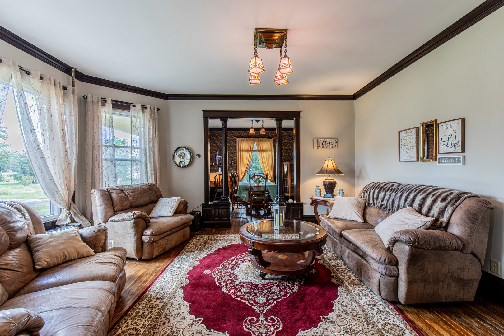 304 Locust Street Mineral, IL 61344 - Photo 9 of 38 a living room with furniture fireplace and a large window