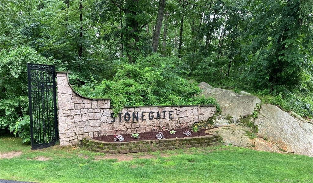 30 Stonegate Circle, Unit B Branford, CT 06405 - Photo 1 of 1 a view of a bench with garden
