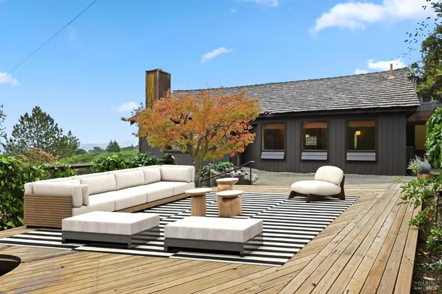 a view of a patio with couches and potted plants