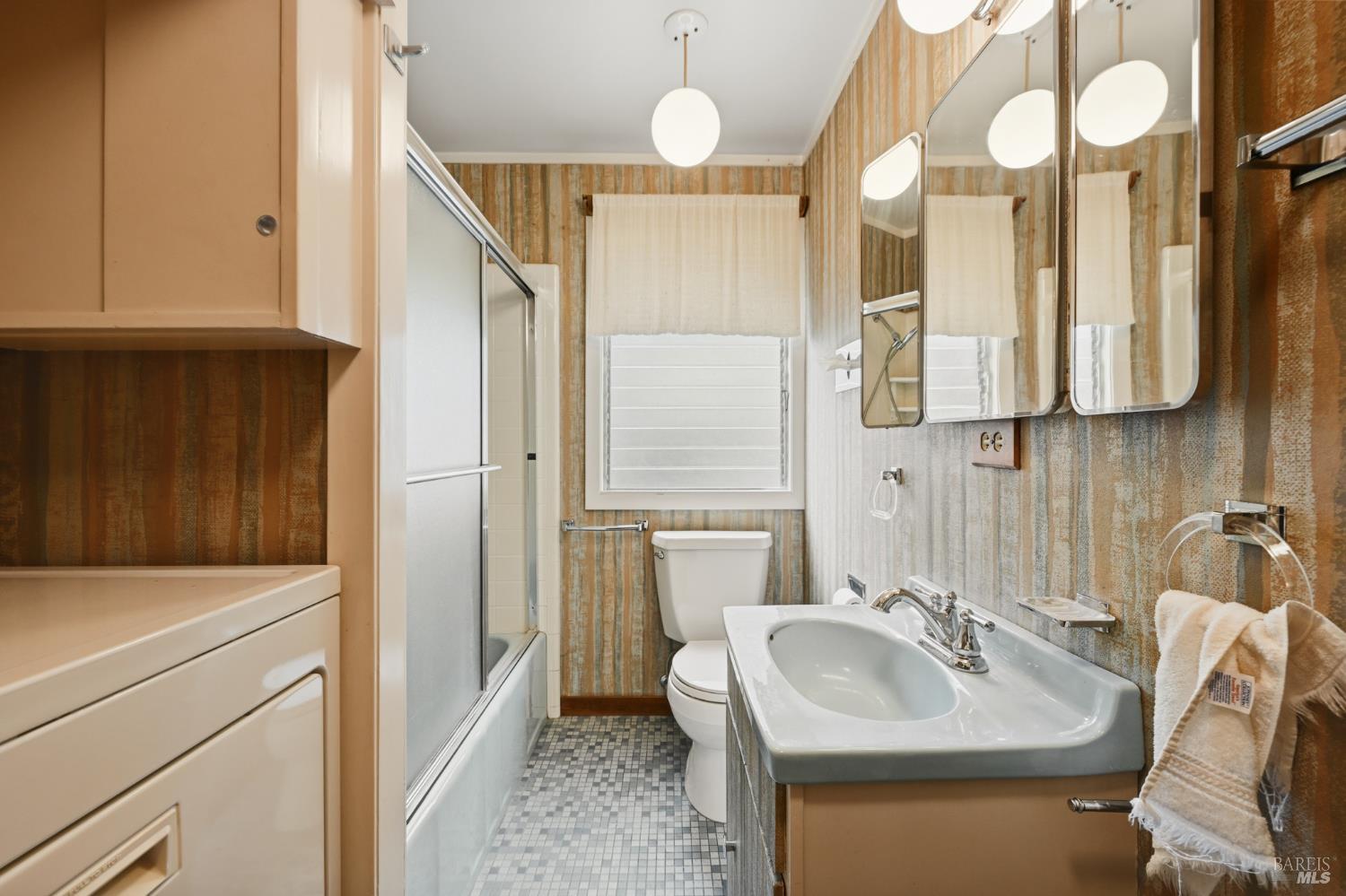 666 Redwood Avenue Corte Madera, CA 94925 - Photo 29 of 43 a bathroom with a sink and a mirror