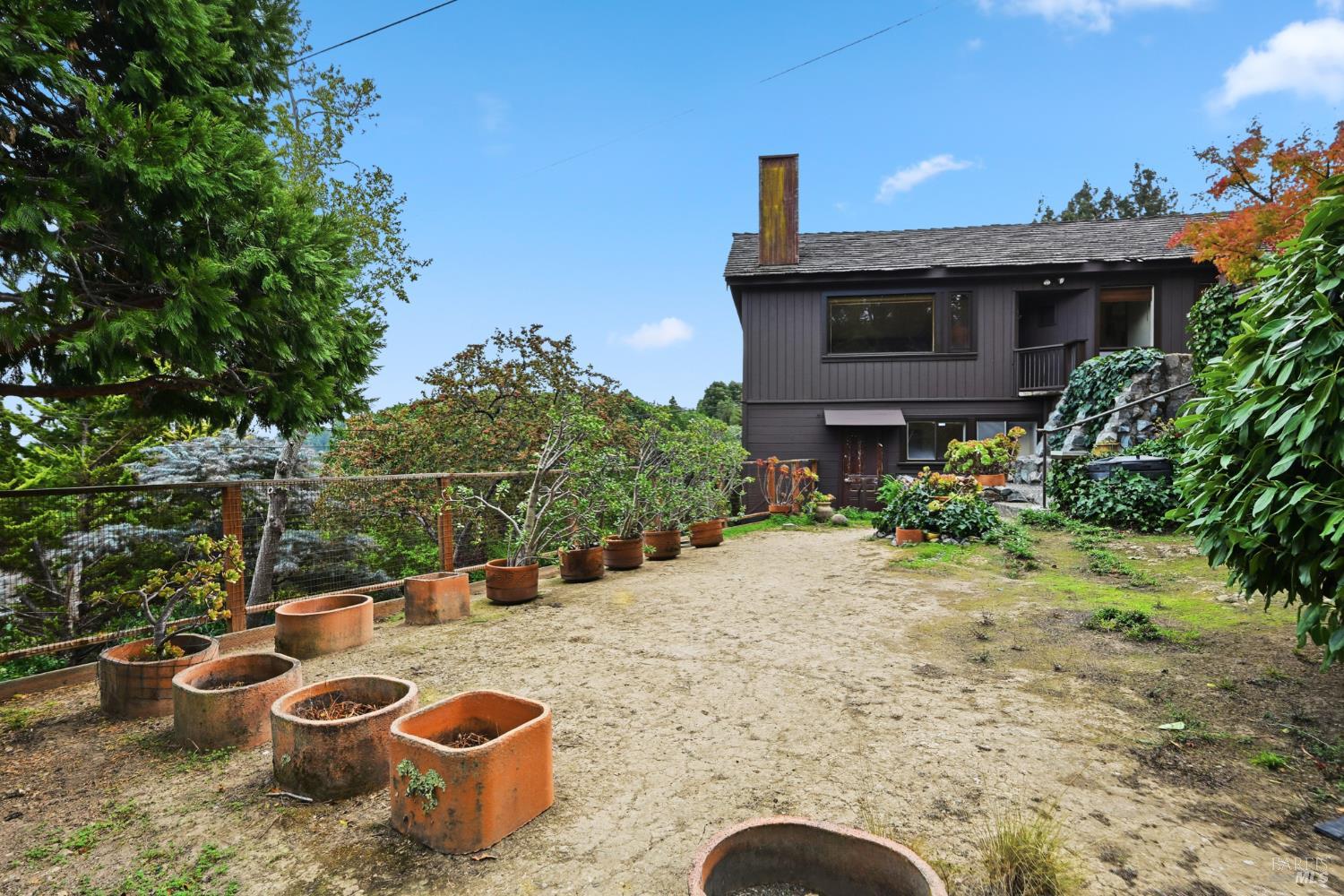 666 Redwood Avenue Corte Madera, CA 94925 - Photo 40 of 43 a view of a backyard with plants and a patio