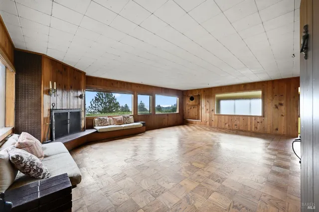 a view of livingroom with furniture and window