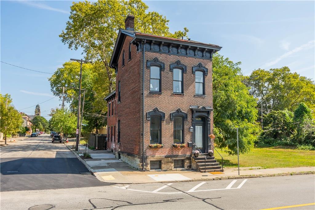 1426 Chateau Street Pittsburgh, PA 15233 - Photo 1 of 45 a view of a brick building next to a yard