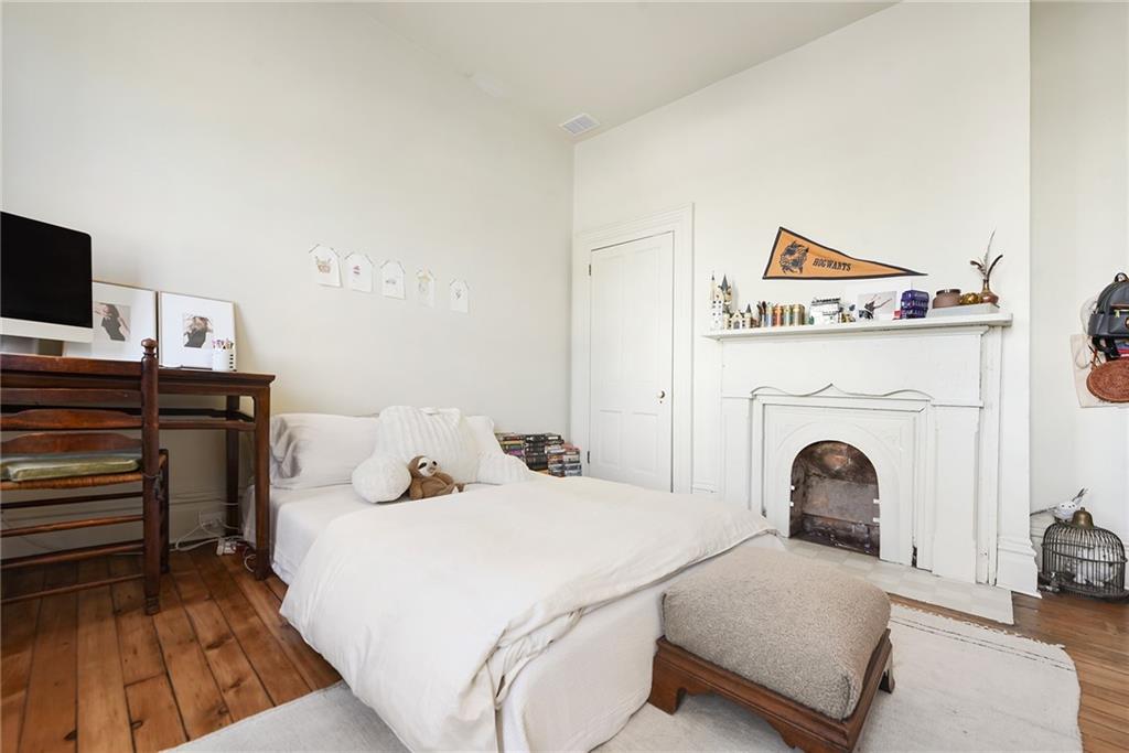 1426 Chateau Street Pittsburgh, PA 15233 - Photo 26 of 45 a bedroom with a bed and a flat screen tv