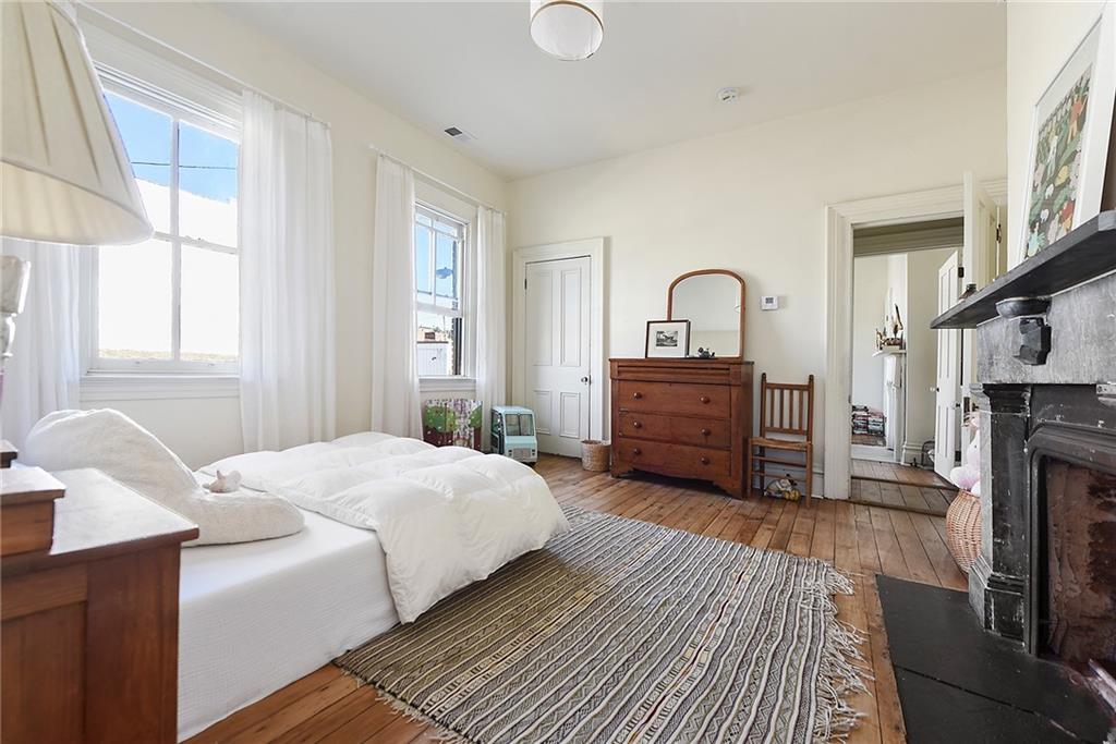 1426 Chateau Street Pittsburgh, PA 15233 - Photo 28 of 45 a spacious bedroom with a bed dresser and a window
