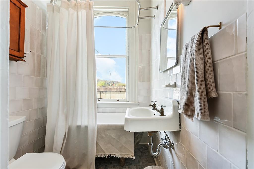 1426 Chateau Street Pittsburgh, PA 15233 - Photo 30 of 45 a bathroom with a sink toilet and shower