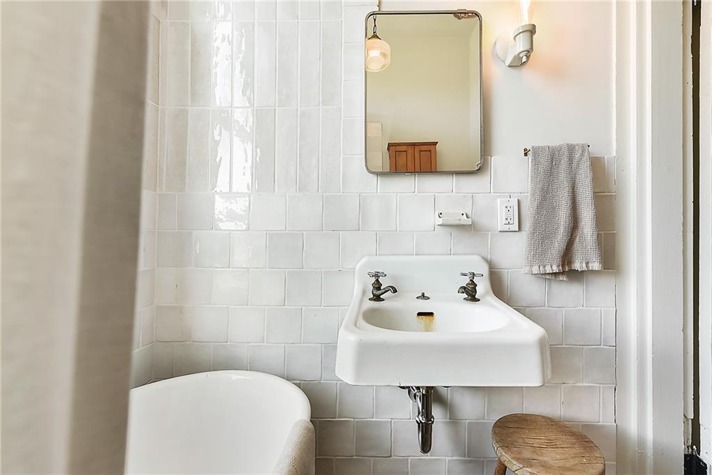 1426 Chateau Street Pittsburgh, PA 15233 - Photo 31 of 45 a bathroom with a sink toilet and mirror