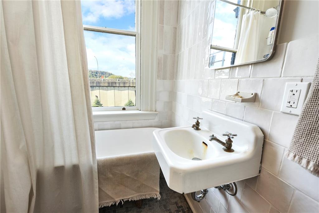 1426 Chateau Street Pittsburgh, PA 15233 - Photo 32 of 45 a bathroom with a sink and a bathtub