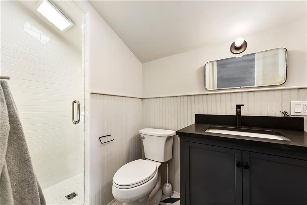 1426 Chateau Street Pittsburgh, PA 15233 - Photo 35 of 45 a bathroom with a granite countertop sink toilet and mirror