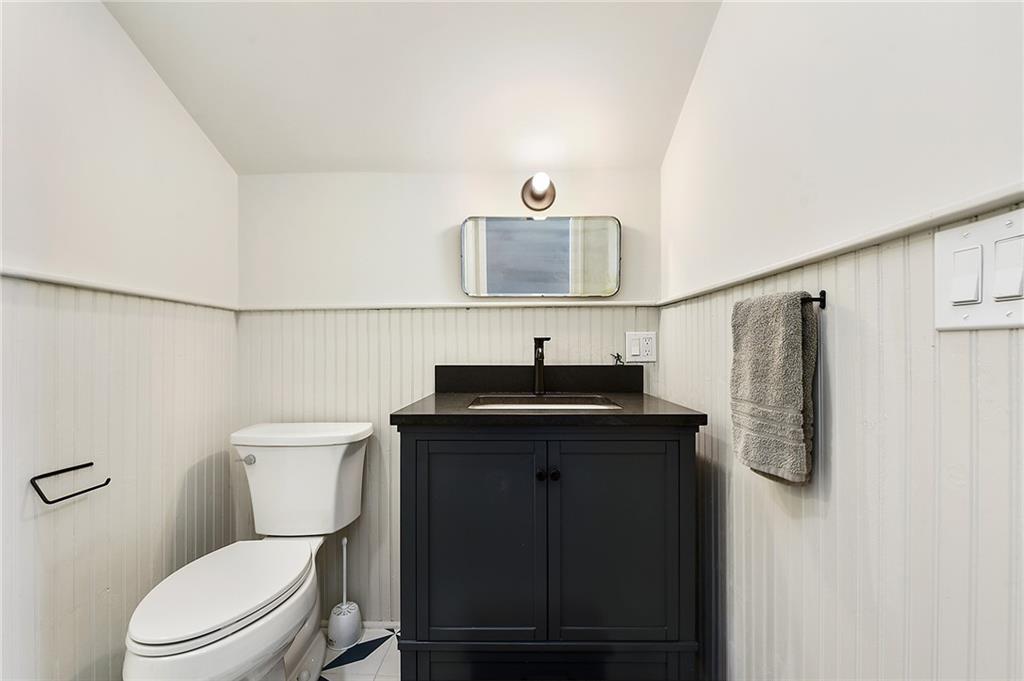 1426 Chateau Street Pittsburgh, PA 15233 - Photo 36 of 45 a bathroom with a toilet sink and mirror