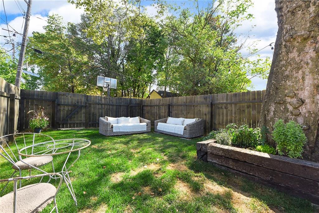 1426 Chateau Street Pittsburgh, PA 15233 - Photo 44 of 45 a view of a backyard with couches plants and large tree