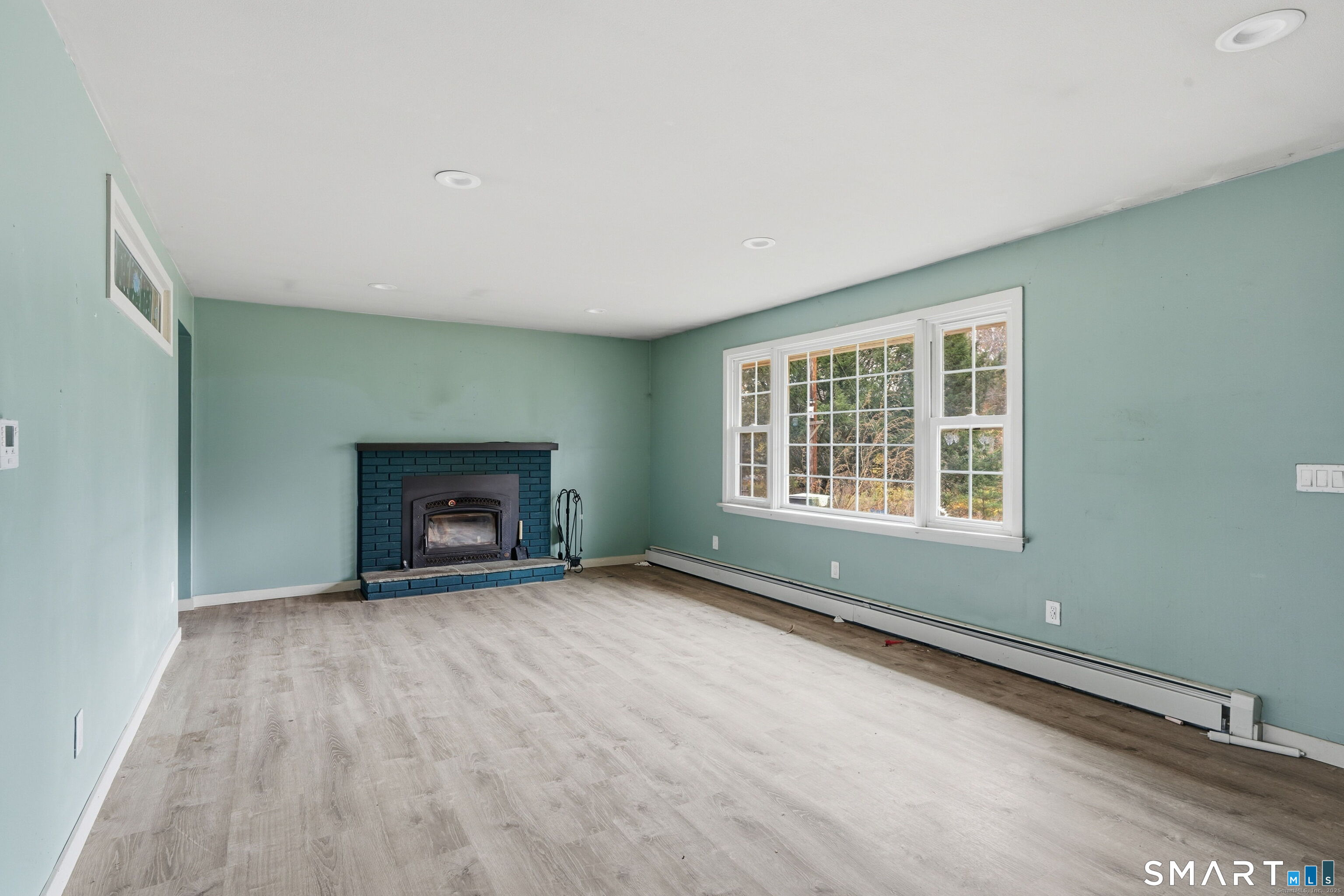 487 Buff Cap Road Tolland, CT 06084 - Photo 4 of 22 an empty room with windows