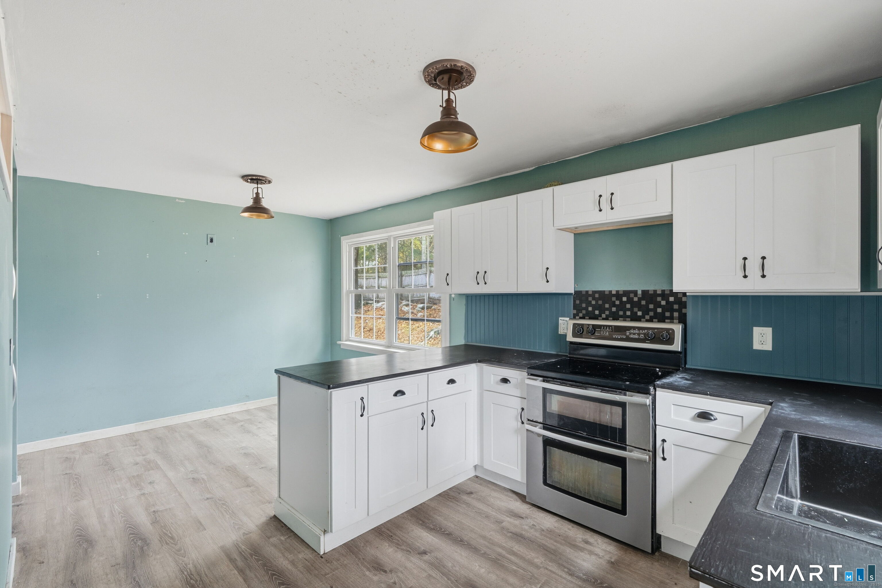 487 Buff Cap Road Tolland, CT 06084 - Photo 8 of 22 a kitchen with granite countertop a stove and a sink