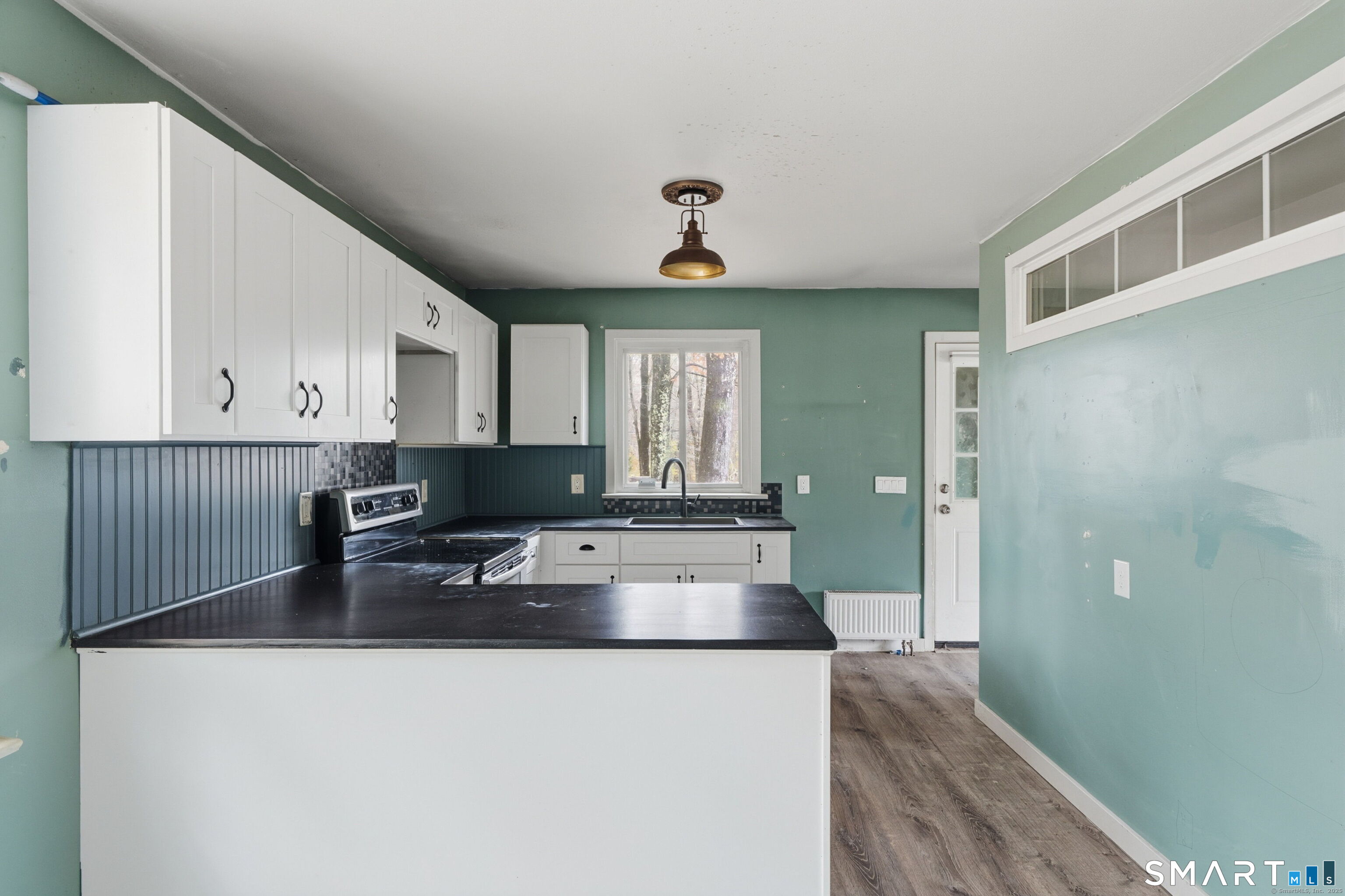 487 Buff Cap Road Tolland, CT 06084 - Photo 10 of 22 a kitchen with granite countertop a sink and a refrigerator